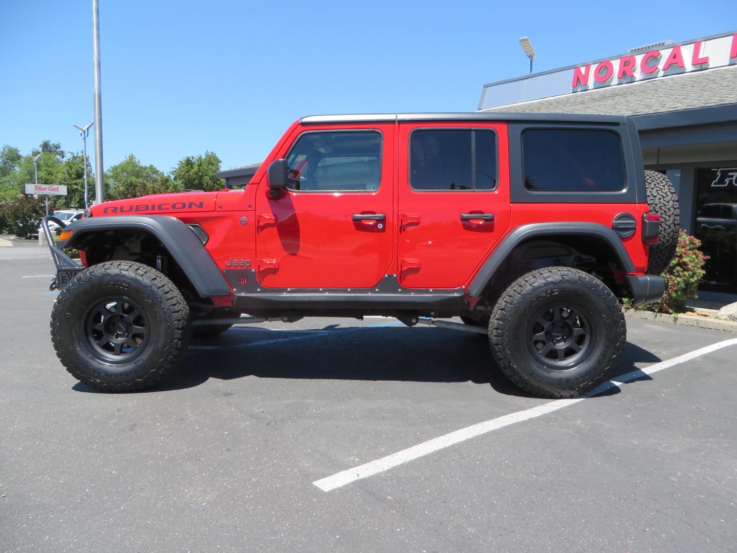 2019 Red /Black Jeep Wrangler Unlimited Rubicon (1C4HJXFN7KW) with an 2.0L L4 DOHC 16V TURBO engine, automatic transmission, located at 2630 Grass Valley Highway, Auburn, CA, 95603, (530) 508-5100, 38.937893, -121.095482 - Rubicon JL ready for all of your offroad adventures. This Jeep is sitting on a Rubicon Express lift kit, RE 2.5 Extreme series shocks, 17" Method bead grip wheels, 37" BFG KO2 tires, EVO front bumper, Warn winch, Road Armor rock slliders, and a HD Jeep spare tire carrier. - Photo#7